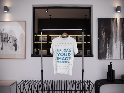 T-Shirt on a Rack Mockup While Inside an Artists Room