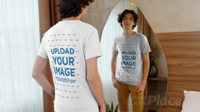 T-Shirt Video of a Young Man Looking at Himself in a Mirror