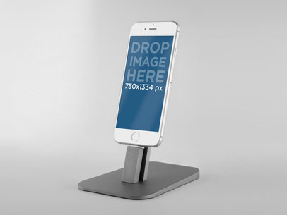 Mockup of a White iPhone 6 on a Grey Stand