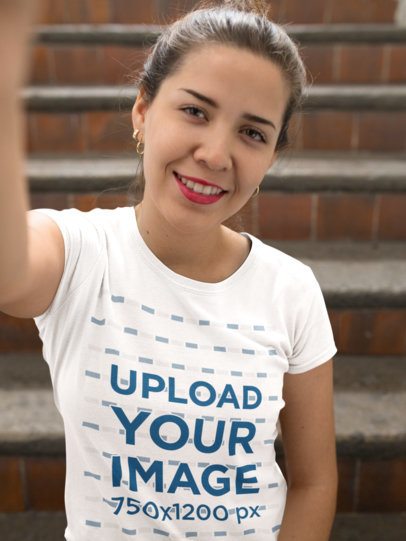 Selfie Mockup of a Woman Wearing a T-Shirt Near Stairways