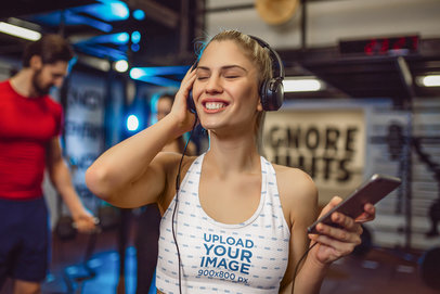 Sports Bra Mockup of a Joyful Woman Listening to Music at the Gym m8543 r-el2