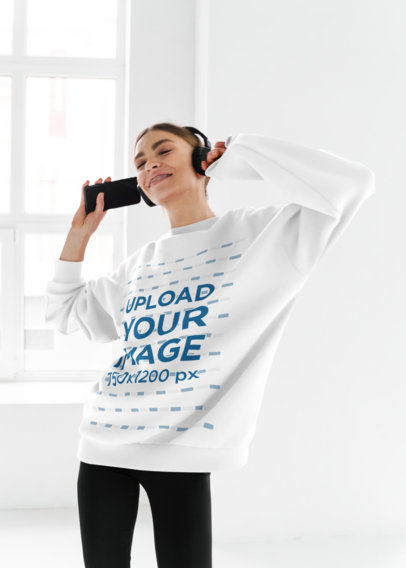 Sweatshirt Mockup Featuring a Joyful in Headphones Woman Dancing 