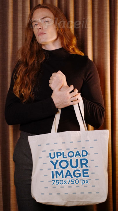 Video of a Long-Haired Man Holding a Tote Bag