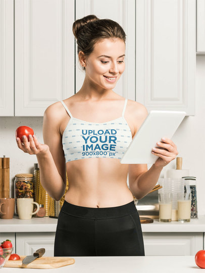 Sports Bra Mockup Featuring a Woman Reading a Healthy Recipe