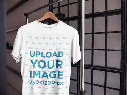 Mockup of a T-Shirt on a Hanger Near a Door a16953