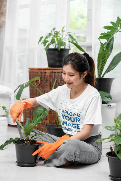 Round-Neck Tee Mockup of a Woman Doing Home Gardening