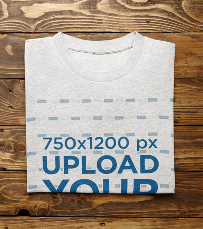 Mockup of a Folded Heather T-Shirt on a Wooden Surface