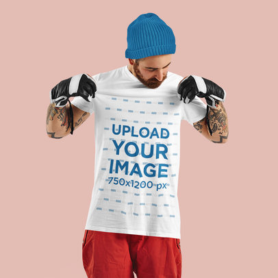 T-Shirt Mockup of a Tattooed Man Wearing Gloves