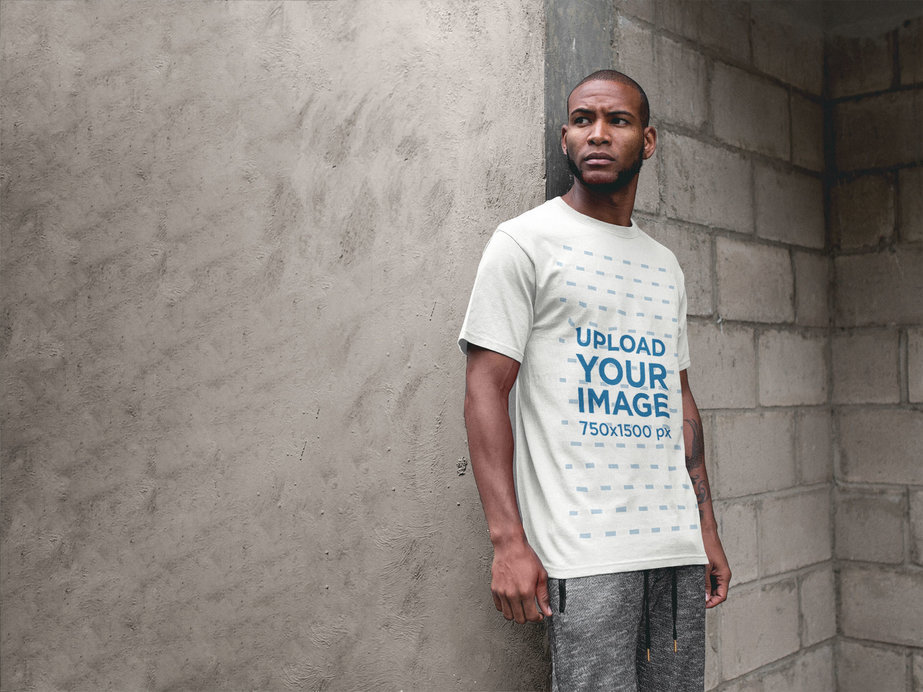 Facebook Ad - Man Leaning Against Concrete Wall While Wearing a T-Shirt