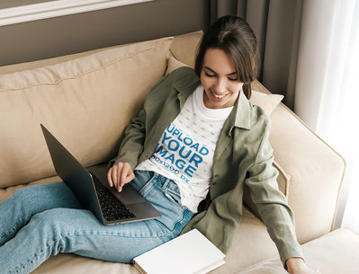 T-Shirt Mockup of a Young Woman Working at Home 