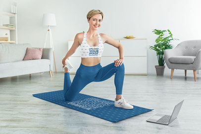 Sports Bra Mockup of a Woman Taking an Online Fitness Class on a Yoga Mat