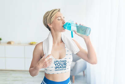 Sports Bra Mockup of a Woman Drinking Fresh Water