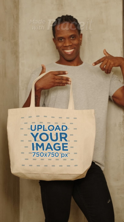 Video Featuring a Happy Man Holding a Tote Bag 
