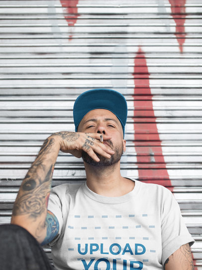 Middle Aged Tattooed Man Smoking and Wearing a T-Shirt Mockup