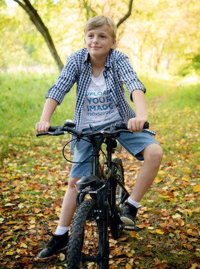 T-Shirt Mockup of a Smiling Boy Riding a Bike