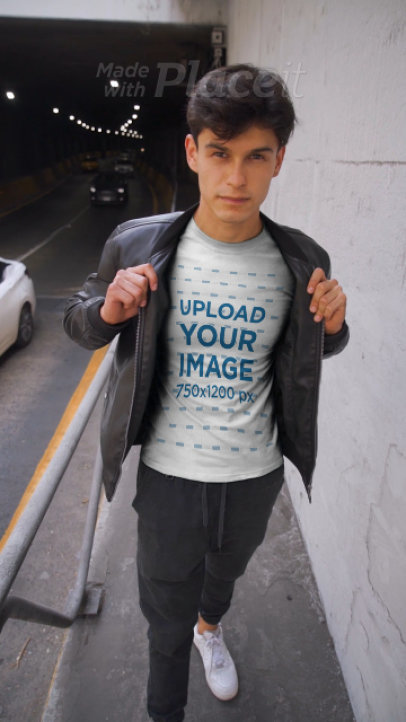 T-Shirt Video of a Young Man Wearing a Leather Garment