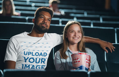 T-Shirt Mockup of a Man at the Movies with His Girlfriend