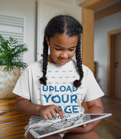 T-Shirt Mockup of a Girl With Braids Using a Tablet m15077 r-el2