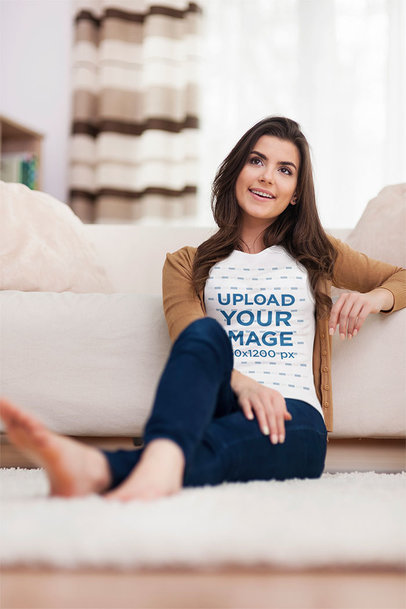 T-Shirt Mockup of s Smiling Woman Sitting on the Floor at Her House m14071 r-el2