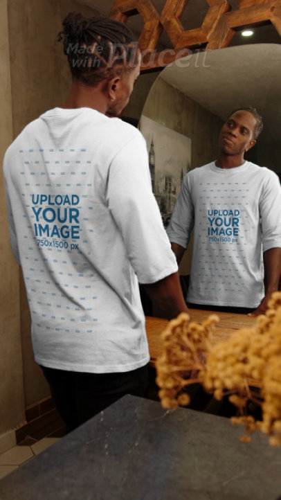 Three-Quarter Sleeve Tee Video of a Smiling Man Posing in Front of a Mirror