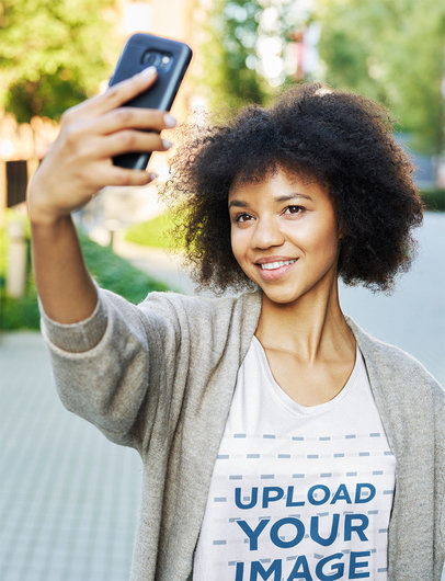 Tee Mockup of a Woman with Curly Hair Taking a Selfie m14076-r-el2