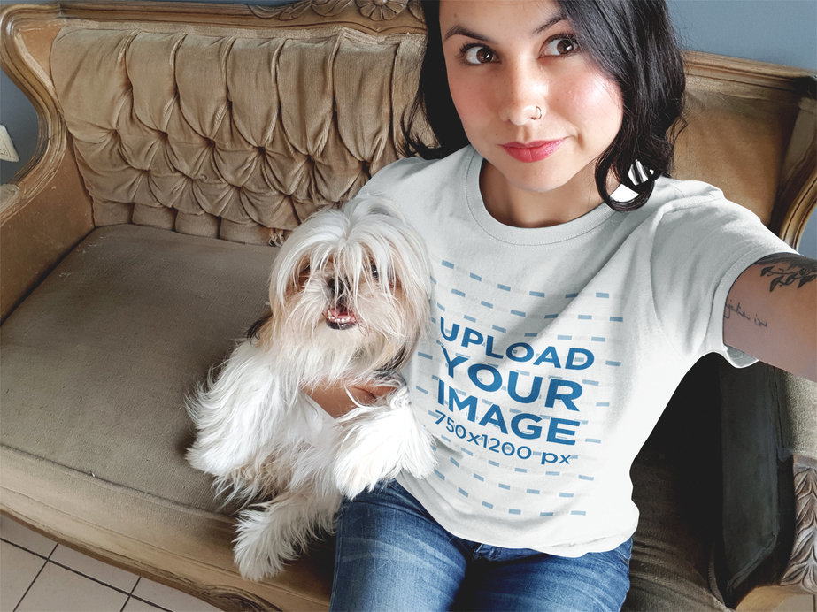 Mockup of a Pretty Woman Wearing a Round Neck Tee While Taking a Selfie with her Dog