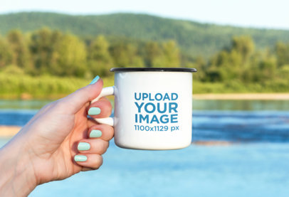Mockup of a Hand Holding an Enamel Mug Behind a Beautiful Landscape M9247-r-el2