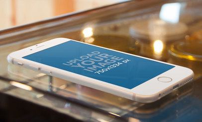 Wide Mockup of an iPhone 6 on a Desert Counter