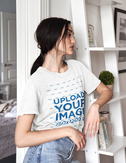 Round-Neck T-Shirt Mockup Featuring a Serious Woman Leaning on a Shelf