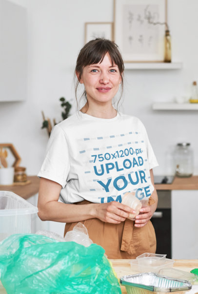 T-Shirt Mockup of a Happy Woman Recycling Plastic at Home