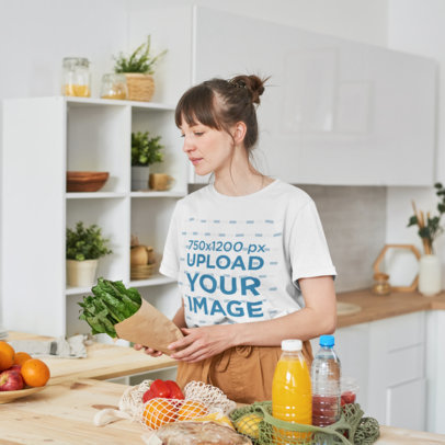 T-Shirt Mockup of a Woman Putting Food on a Table