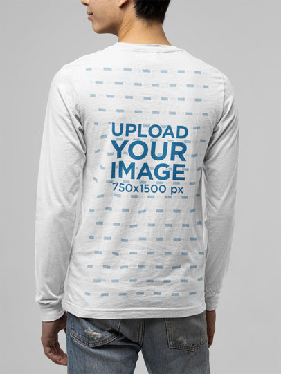 Back View Mockup of a Young Man Wearing a Customizable Long Sleeve Tee 