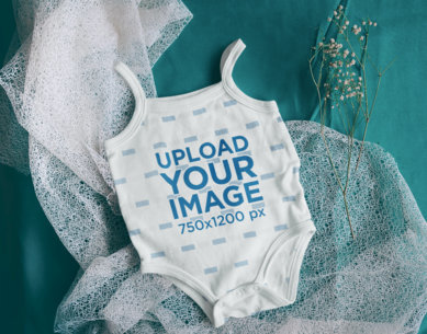 Mockup of a Baby Onesie Flat Laid over an Aesthetic Surface m8631 r-el2