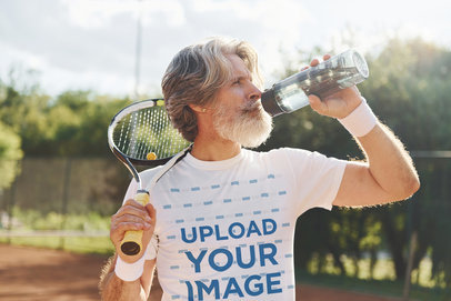 Round-Neck Tee Mockup of a Senior Tennis Player Drinking Water