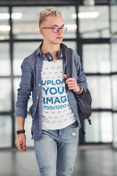 V-Neck Tee Mockup of a Man Walking with a Backpack on His Shoulder