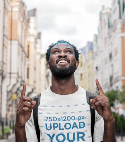T-Shirt Mockup of a Happy Tourist Enjoying the View of a New City