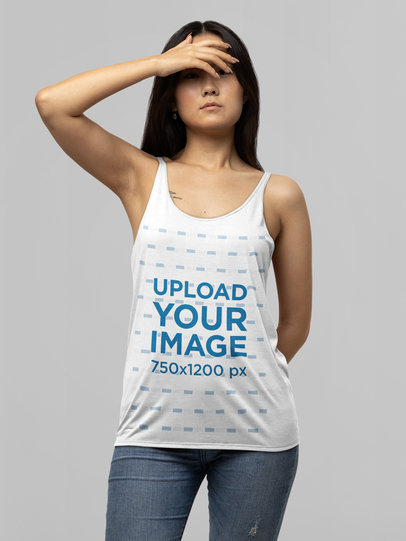 Mockup of a Serious Long-Haired Woman Wearing a Bella Canvas Tank Top 