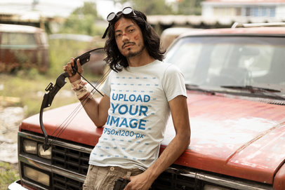 Zombie Apocalypse-Themed T-Shirt Mockup Featuring a Man Posing by an Old Truck