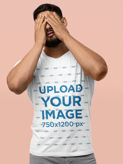 Bella Canvas T-Shirt Mockup Featuring a Bearded Man Covering His Face With His Hands