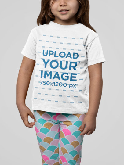 T-Shirt Mockup of a Little Girl Wearing Pants with a Fun Pattern