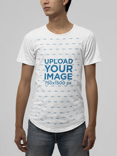 T-Shirt Mockup of a Young Man Wearing a Bella Canvas Garment in a Studio
