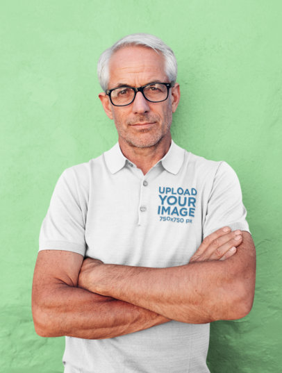 Polo Shirt Mockup Featuring a Man With His Arms Crossed 