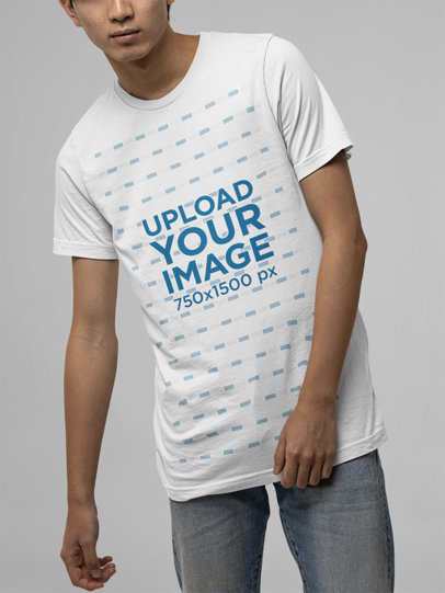Bella Canvas T-Shirt Mockup of a Man Posing Against a Customizable Surface