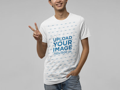 Bella Canvas T-Shirt Mockup of a Man Making a Peace Sign