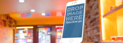 Mockup of an iPhone 6 at a Small Bakery