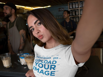 Woman Taking a Selfie While at a Coffee Counter Bar Wearing a Tshirt