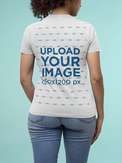 Back-View Mockup of a Woman with Curly Hair Wearing a Bella Canvas Tee