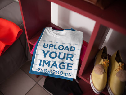 Mockup of a Folded Round Neck Tee on top of Another Tee in a Storage Unit a16940