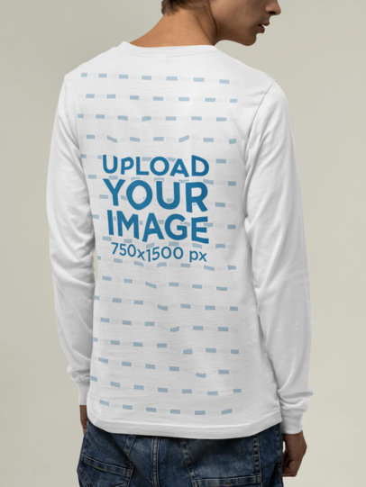 Back View Mockup of a Man Wearing a Bella Canvas Long Sleeve Tee at a Studio