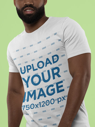 Bella Canvas Tee Mockup of a Bearded Man Against a Solid Background